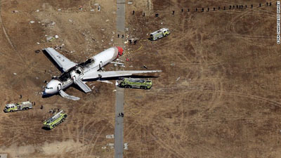 Scene of the crash. Emergency vehicles surround the burned hulk of Asiana Airlines Flight 214 from South Korea that crashed upon landing Saturday at San Francisco’s airport. Photo courtesy: CNN.