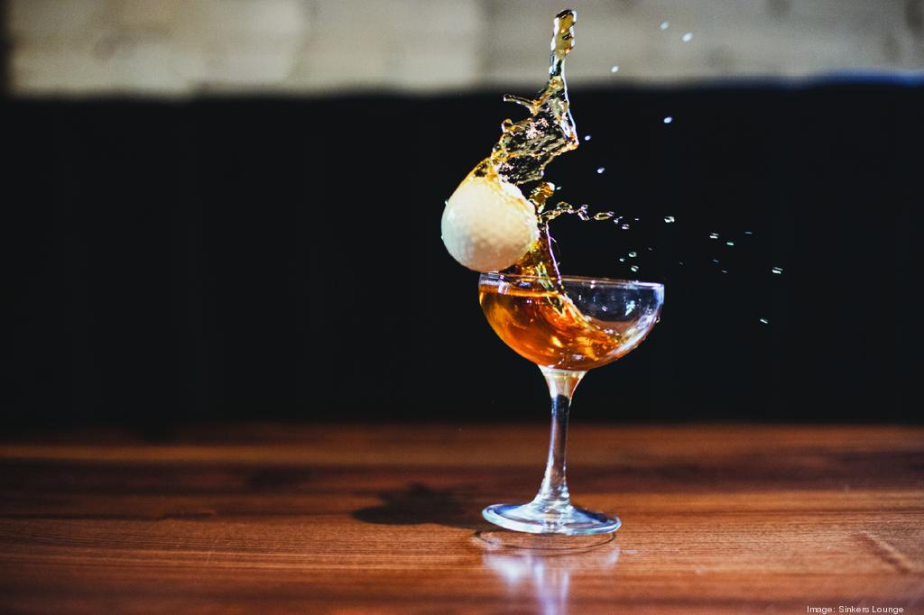 Picture of a golf ball and a cocktail
